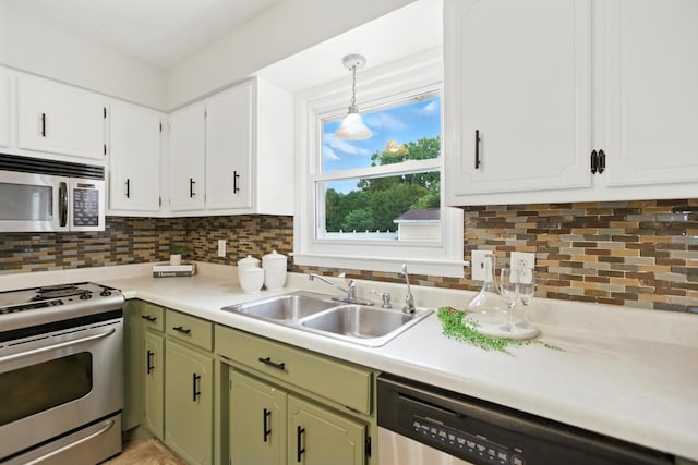 215 Patrick St, Estill Springs, TN 37330 - kitchen featuring appliances with stainless steel finishes, light countertops, green cabinets, backsplash, and white cabinetry