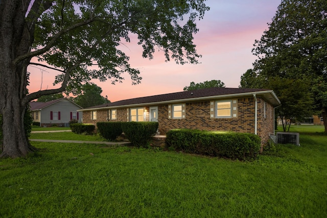 215 Patrick St, Estill Springs, TN 37330 - ranch-style house with a front lawn and brick siding