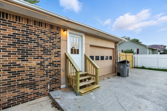215 Patrick St, Estill Springs, TN 37330 - doorway to property with brick siding and an attached garage