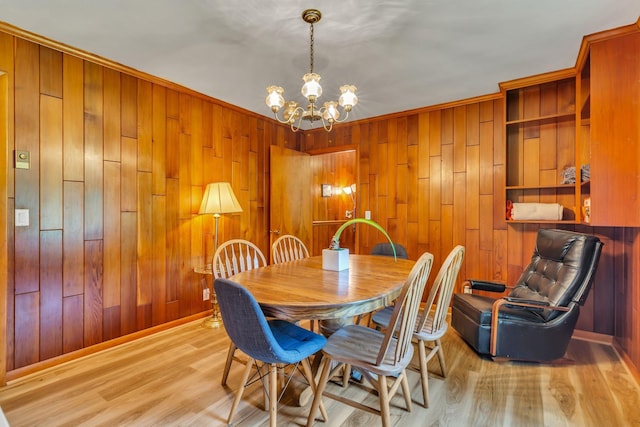 1011 S Baird Ln, Murfreesboro, TN 37130 - dining space with a chandelier, wood walls, and wood finished floors