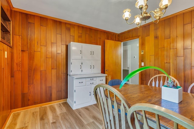 1011 S Baird Ln, Murfreesboro, TN 37130 - dining room featuring a chandelier, wood walls, and light wood finished floors