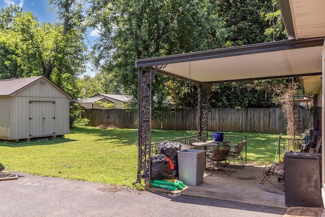 1011 S Baird Ln, Murfreesboro, TN 37130 - fenced backyard with a patio, a storage shed, and outdoor dining area