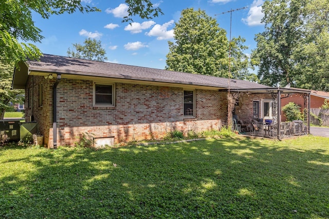 1011 S Baird Ln, Murfreesboro, TN 37130 - rear view of property featuring brick siding, a lawn, and a patio area