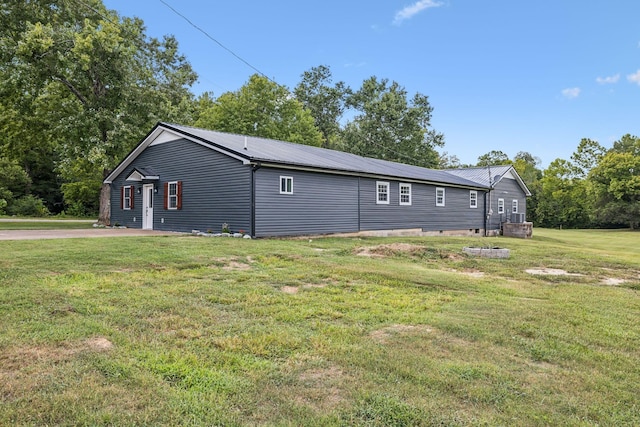 140 Cane Creek Rd, Hohenwald, TN 38462 - view of side of property featuring a yard, a metal roof, and crawl space