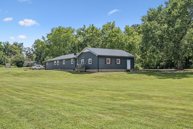 140 Cane Creek Rd, Hohenwald, TN 38462 - view of side of property with a yard and a metal roof