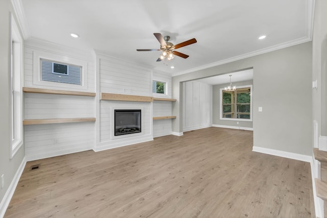 578 Pongracz Way, Clarksville, TN 37042 - unfurnished living room with a chandelier, crown molding, ceiling fan, a large fireplace, and wood finished floors