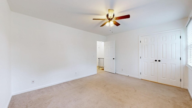 1002 E Northfield Blvd Unit G105, Murfreesboro, TN 37130 - unfurnished bedroom featuring light carpet, a ceiling fan, a closet, and multiple windows