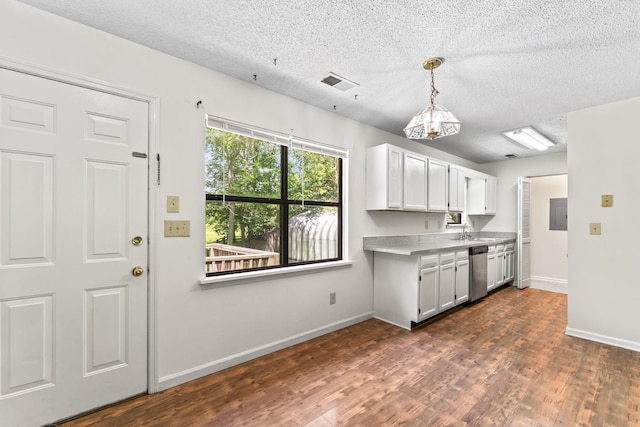 2200 Rawls Rd, Greenbrier, TN 37073 - kitchen with stainless steel dishwasher, a textured ceiling, dark wood finished floors, decorative light fixtures, and white cabinetry