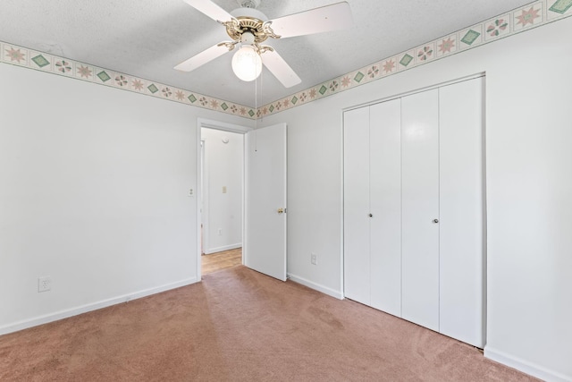 2200 Rawls Rd, Greenbrier, TN 37073 - unfurnished bedroom with carpet floors, a closet, a textured ceiling, and ceiling fan