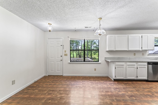 2200 Rawls Rd, Greenbrier, TN 37073 - kitchen with dishwasher, light countertops, dark wood-style floors, white cabinetry, and a textured ceiling