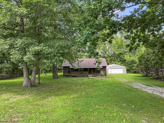 2200 Rawls Rd, Greenbrier, TN 37073 - view of grassy yard with a detached garage and an outdoor structure