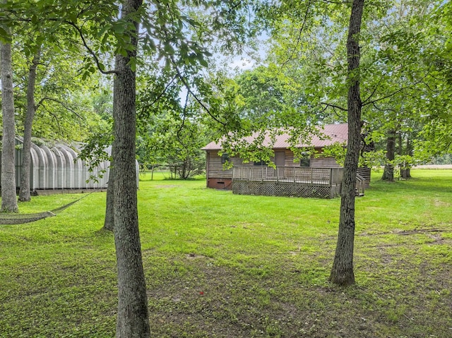 2200 Rawls Rd, Greenbrier, TN 37073 - view of grassy yard featuring a deck
