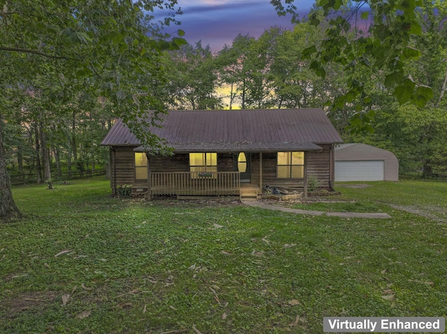 2200 Rawls Rd, Greenbrier, TN 37073 - chalet / cabin with a porch, a lawn, a detached garage, and a metal roof