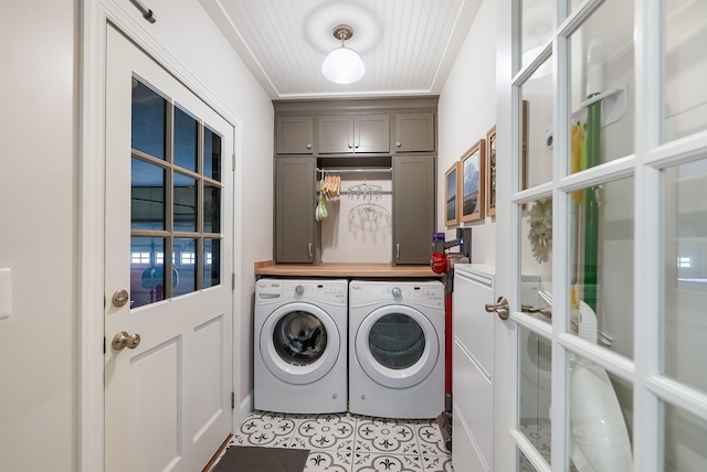 509 Iris Ave, Murfreesboro, TN 37128 - laundry area with washer and clothes dryer, cabinet space, and light tile patterned floors
