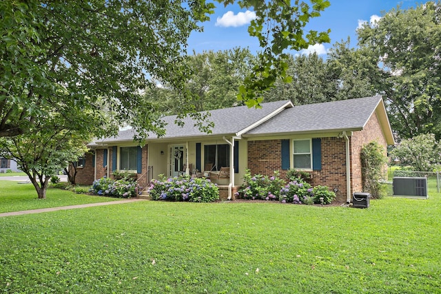 509 Iris Ave, Murfreesboro, TN 37128 - single story home with a porch, brick siding, a front lawn, and roof with shingles