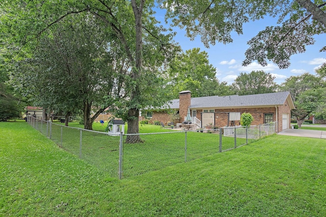 509 Iris Ave, Murfreesboro, TN 37128 - view of yard with a garage and concrete driveway