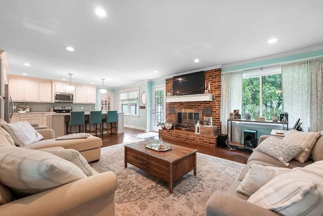 509 Iris Ave, Murfreesboro, TN 37128 - living room featuring crown molding, a fireplace, wood finished floors, and recessed lighting