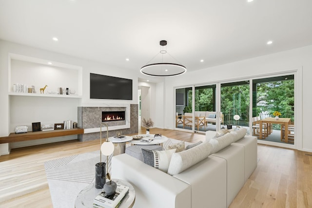 4045 Outer Dr, Nashville, TN 37204 - living room featuring a premium fireplace, light wood finished floors, and recessed lighting