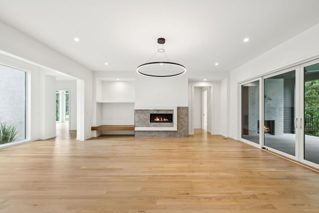 4045 Outer Dr, Nashville, TN 37204 - unfurnished living room with a premium fireplace, light wood-type flooring, and recessed lighting