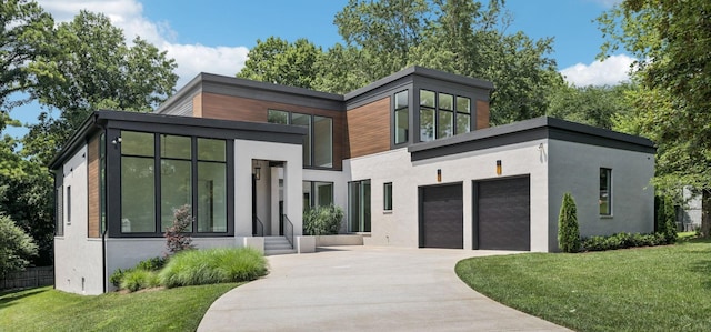 4045 Outer Dr, Nashville, TN 37204 - contemporary house featuring driveway, stucco siding, and an attached garage