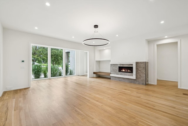4045 Outer Dr, Nashville, TN 37204 - unfurnished living room with recessed lighting, light wood finished floors, a fireplace, and built in shelves