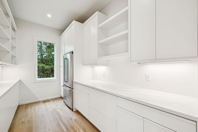 4045 Outer Dr, Nashville, TN 37204 - kitchen with open shelves, modern cabinets, high end fridge, white cabinetry, and recessed lighting