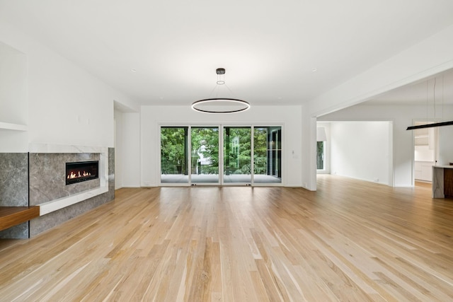 4045 Outer Dr, Nashville, TN 37204 - unfurnished living room with light wood-style floors and a high end fireplace