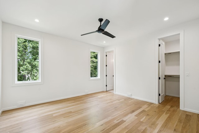 4045 Outer Dr, Nashville, TN 37204 - unfurnished bedroom featuring multiple windows, light wood-type flooring, a spacious closet, recessed lighting, and ceiling fan