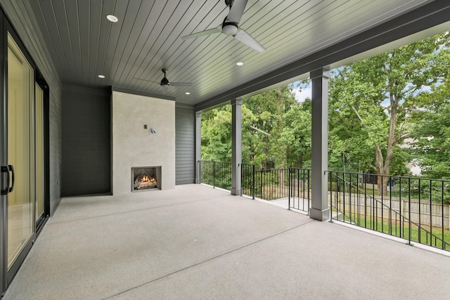 4045 Outer Dr, Nashville, TN 37204 - view of patio / terrace with a fireplace, a ceiling fan, and view of scattered trees