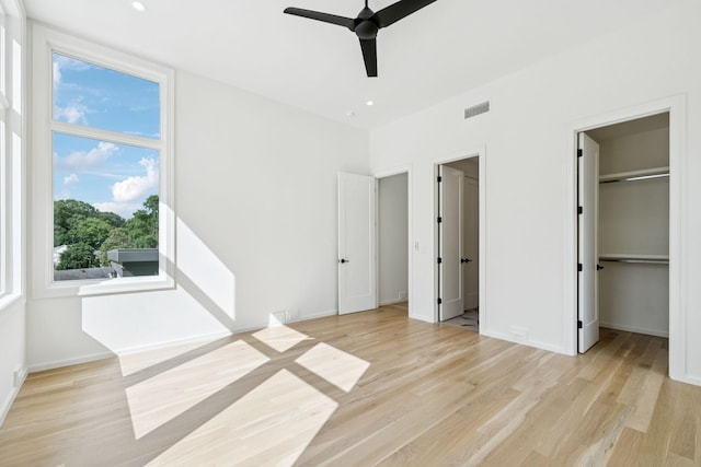 4045 Outer Dr, Nashville, TN 37204 - unfurnished bedroom featuring light wood-style flooring, a walk in closet, and ceiling fan