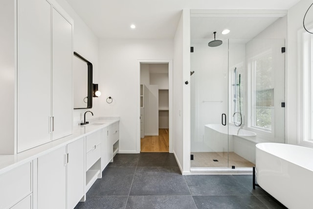 4045 Outer Dr, Nashville, TN 37204 - full bath featuring a stall shower, double vanity, a soaking tub, healthy amount of natural light, and recessed lighting