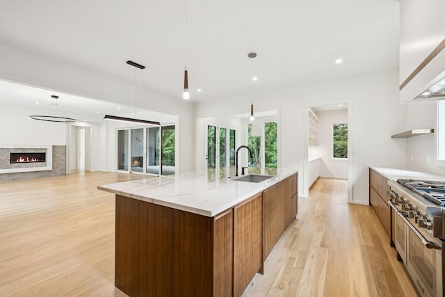 4045 Outer Dr, Nashville, TN 37204 - kitchen featuring range with two ovens, modern cabinets, light wood finished floors, a spacious island, and recessed lighting