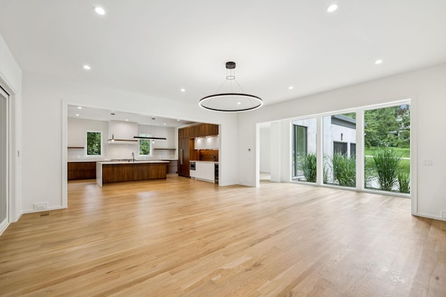 4045 Outer Dr, Nashville, TN 37204 - unfurnished living room with healthy amount of natural light, light wood finished floors, and recessed lighting