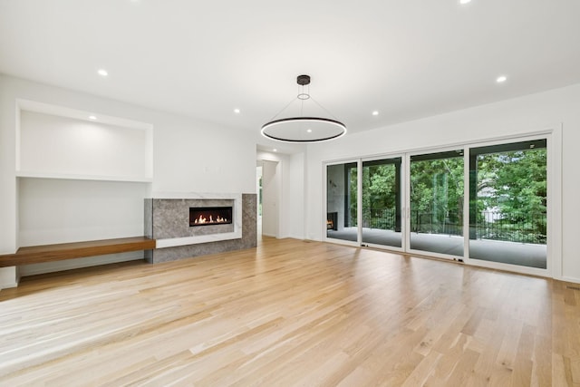 4045 Outer Dr, Nashville, TN 37204 - unfurnished living room featuring a premium fireplace, wood finished floors, and recessed lighting