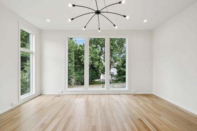 4045 Outer Dr, Nashville, TN 37204 - empty room with plenty of natural light, a chandelier, and light wood-type flooring