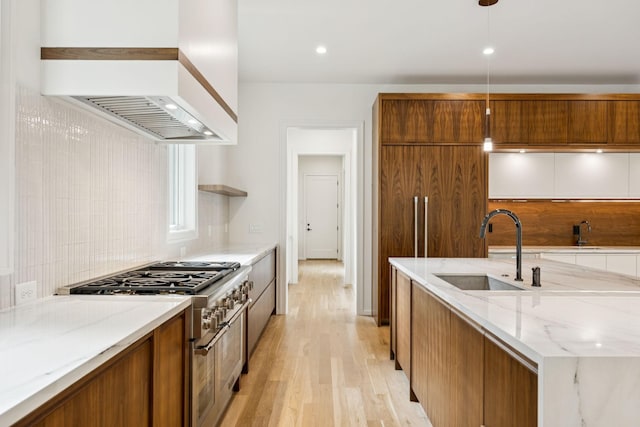 4045 Outer Dr, Nashville, TN 37204 - kitchen featuring premium range hood, range with two ovens, brown cabinets, and light wood finished floors