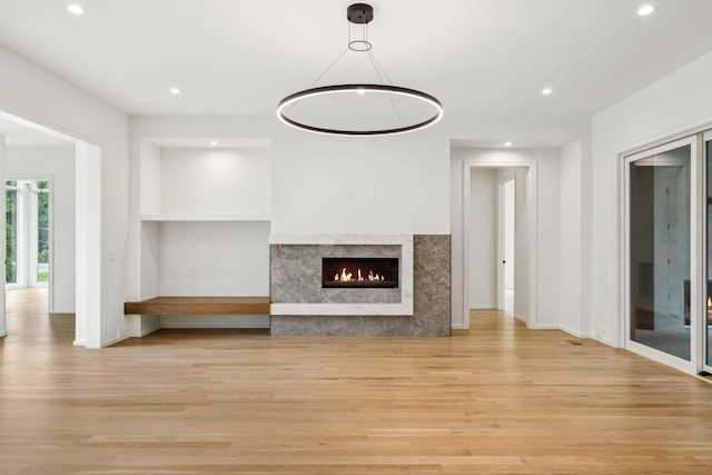 4045 Outer Dr, Nashville, TN 37204 - unfurnished living room featuring light wood-style flooring, recessed lighting, and a high end fireplace