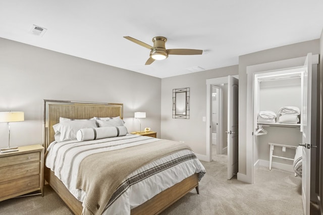 2030 Oliver Dr, Mount Juliet, TN 37122 - bedroom with light colored carpet, a ceiling fan, and a walk in closet