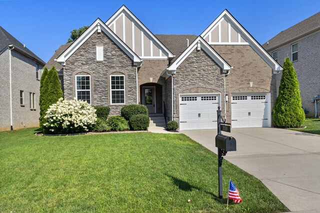 2030 Oliver Dr, Mount Juliet, TN 37122 - view of front facade featuring driveway, board and batten siding, stone siding, and a front lawn