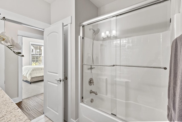 2030 Oliver Dr, Mount Juliet, TN 37122 - ensuite bathroom with shower / bath combination with glass door and wood finished floors