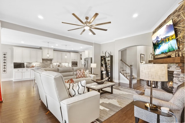 2030 Oliver Dr, Mount Juliet, TN 37122 - living room featuring ceiling fan, arched walkways, a fireplace, hardwood / wood-style flooring, and recessed lighting