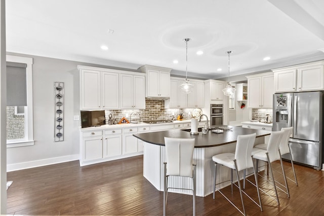 2030 Oliver Dr, Mount Juliet, TN 37122 - kitchen featuring stainless steel appliances, backsplash, white cabinetry, a breakfast bar area, and recessed lighting