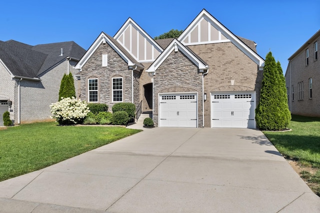 2030 Oliver Dr, Mount Juliet, TN 37122 - view of front facade with driveway, stone siding, a front lawn, and a garage