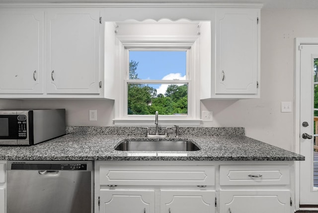 712 Green Valley Ct, Clarksville, TN 37042 - kitchen with stainless steel appliances, white cabinetry, and stone countertops