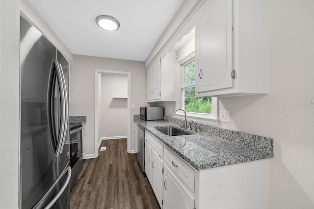 712 Green Valley Ct, Clarksville, TN 37042 - kitchen featuring stainless steel appliances, white cabinets, light stone counters, and dark wood-style flooring