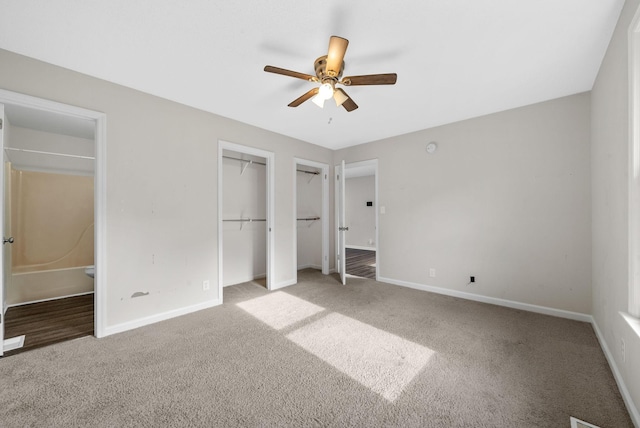 712 Green Valley Ct, Clarksville, TN 37042 - unfurnished bedroom featuring light colored carpet, connected bathroom, a ceiling fan, and multiple closets