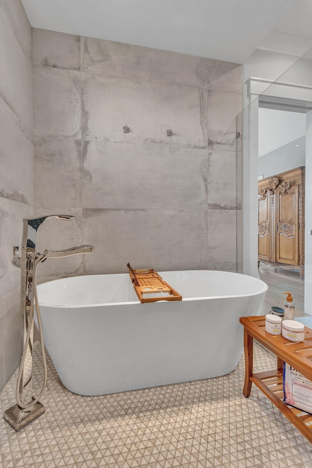 2113 Southern Preserve Ln, Franklin, TN 37064 - bathroom featuring tile walls and a freestanding bath