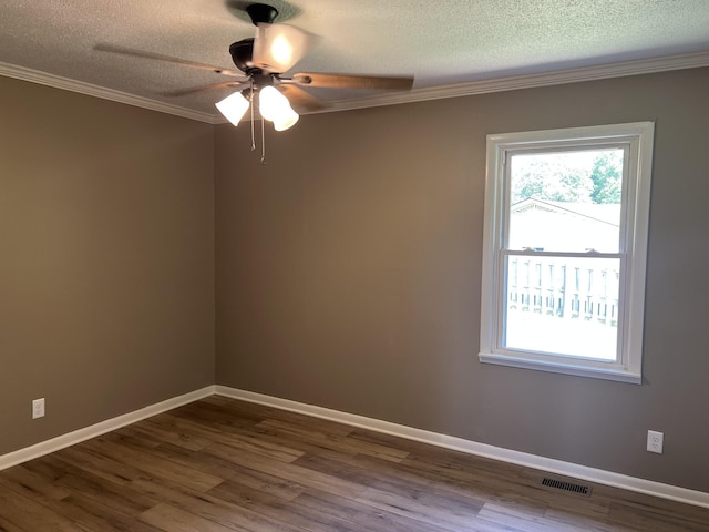 208 Skyline Dr, Red Boiling Springs, TN 37150 - unfurnished room featuring a ceiling fan, ornamental molding, a textured ceiling, and dark wood finished floors