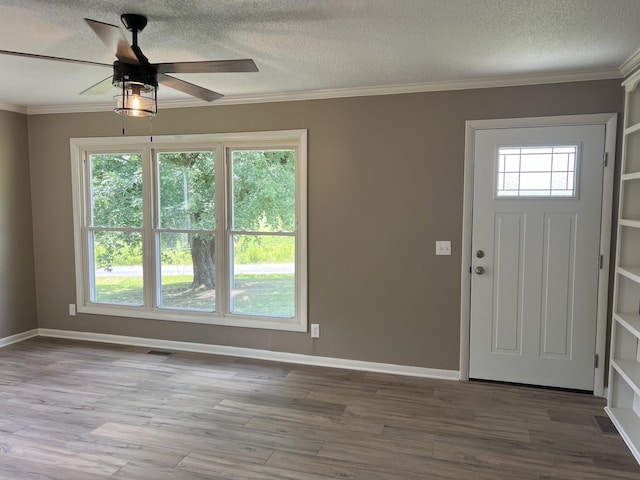 208 Skyline Dr, Red Boiling Springs, TN 37150 - foyer entrance featuring wood finished floors, crown molding, a textured ceiling, and a ceiling fan