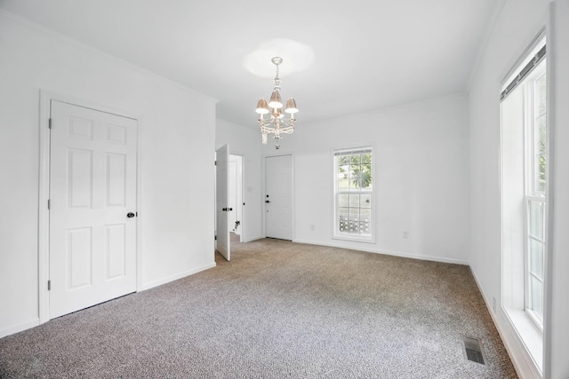 1885 N Soules Chapel Rd, Cunningham, TN 37052 - spare room featuring carpet flooring and a chandelier